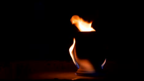 burning ceramic mug on pottery wheel