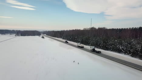 trucks on a snowy highway