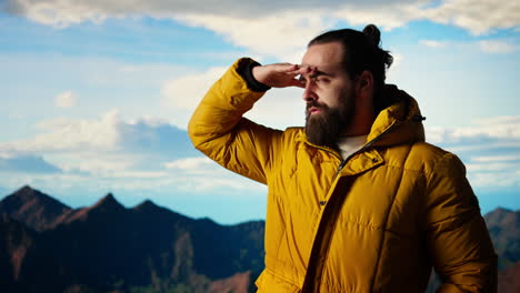 male explorer standing at a scenic viewpoint appreciating the peaceful beauty