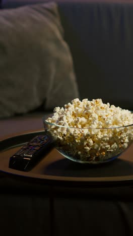 vertical video close up of snack prepared for movie night in home theatre