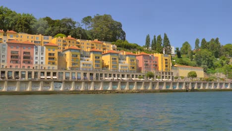 buildings on douro riverbank in porto, portugal - pov