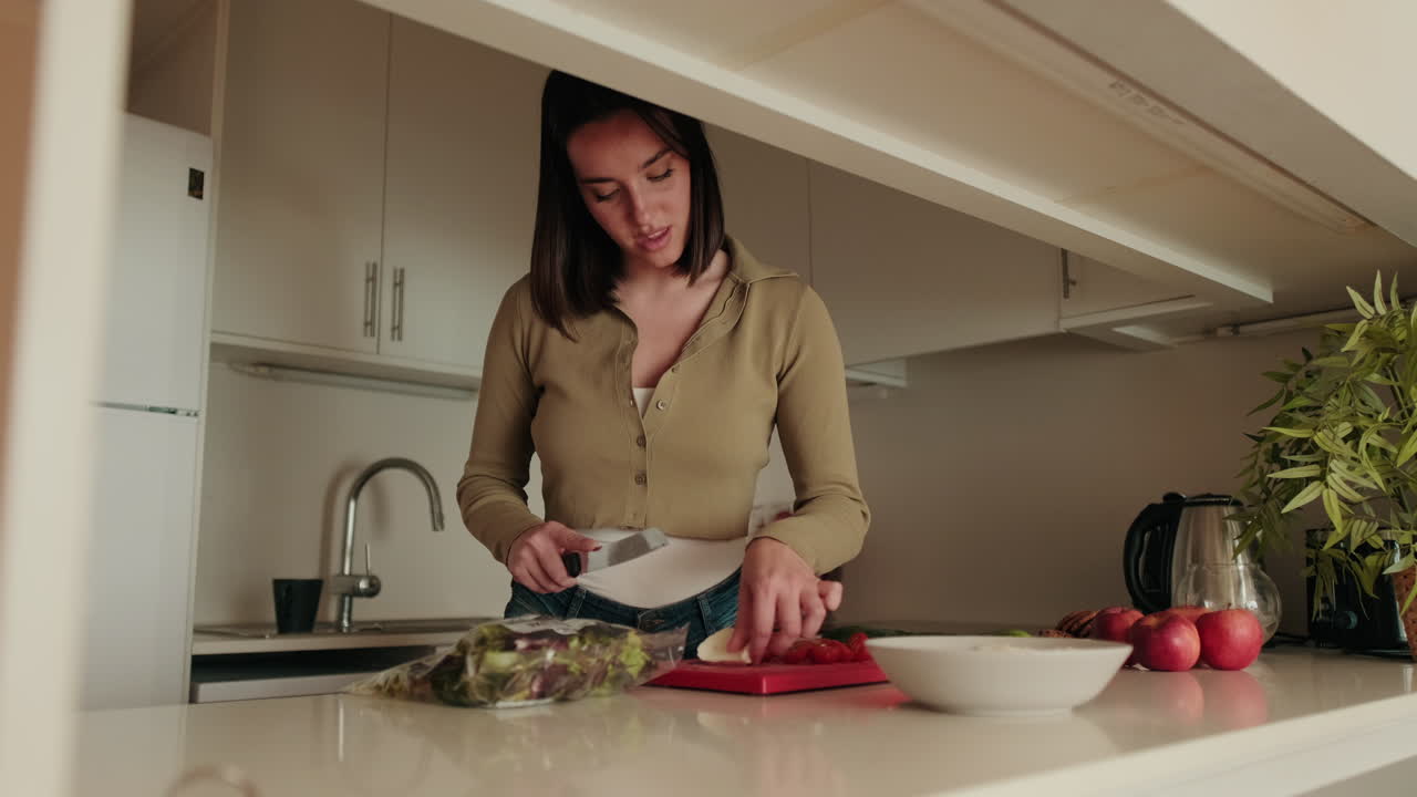 Woman Making Salad in a Modern Kitchen