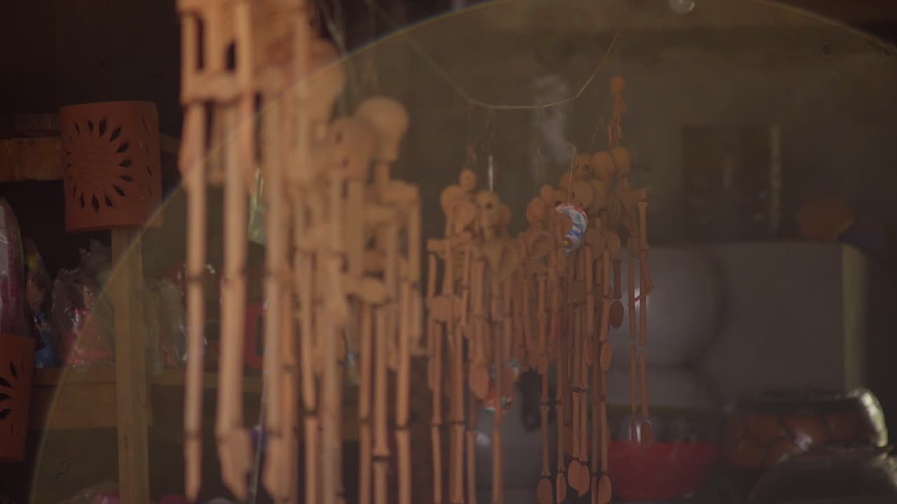 CATRINAS AND SKULLS HANGING FROM A CEALING
