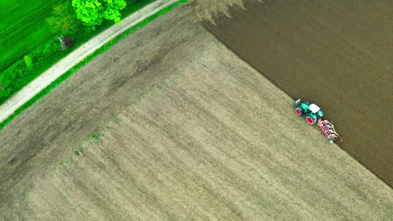 drone fly over field plowing tractor 4k
