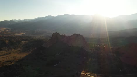 garden of the gods sunset flare mountain range aerial pan shot 4k