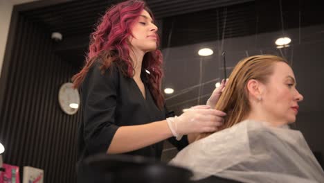 a woman is getting her hair dyed by a hairdresser 4k 2025 08 04 23 14 26 utc.mov | air, attractive, attractiveness, barber