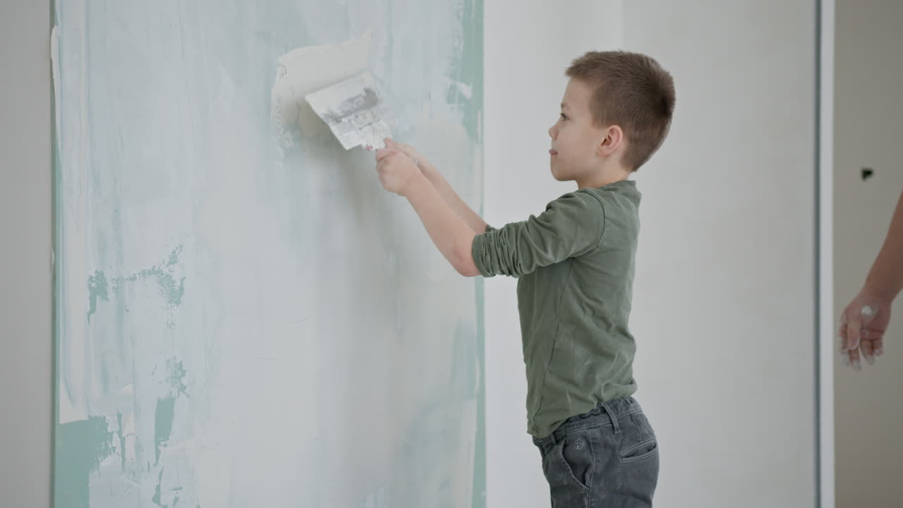 Boy Helping Father Plaster Wall