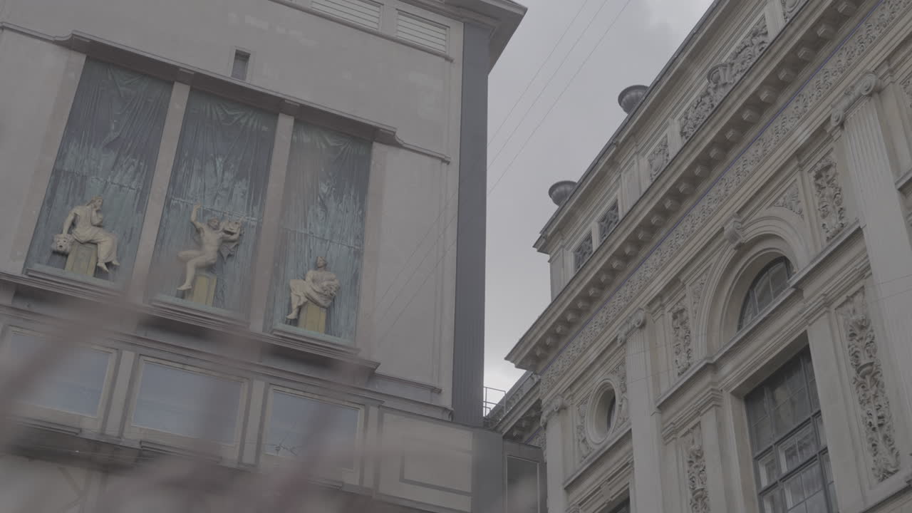August Bournonvilles Passage shot of statues in Copenhagen Denmark on a cloudy day LOG