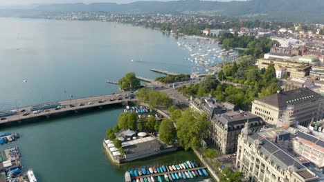 aerial pan up reveals lake zurich in downtown zurich, switzerland on beautiful summer day