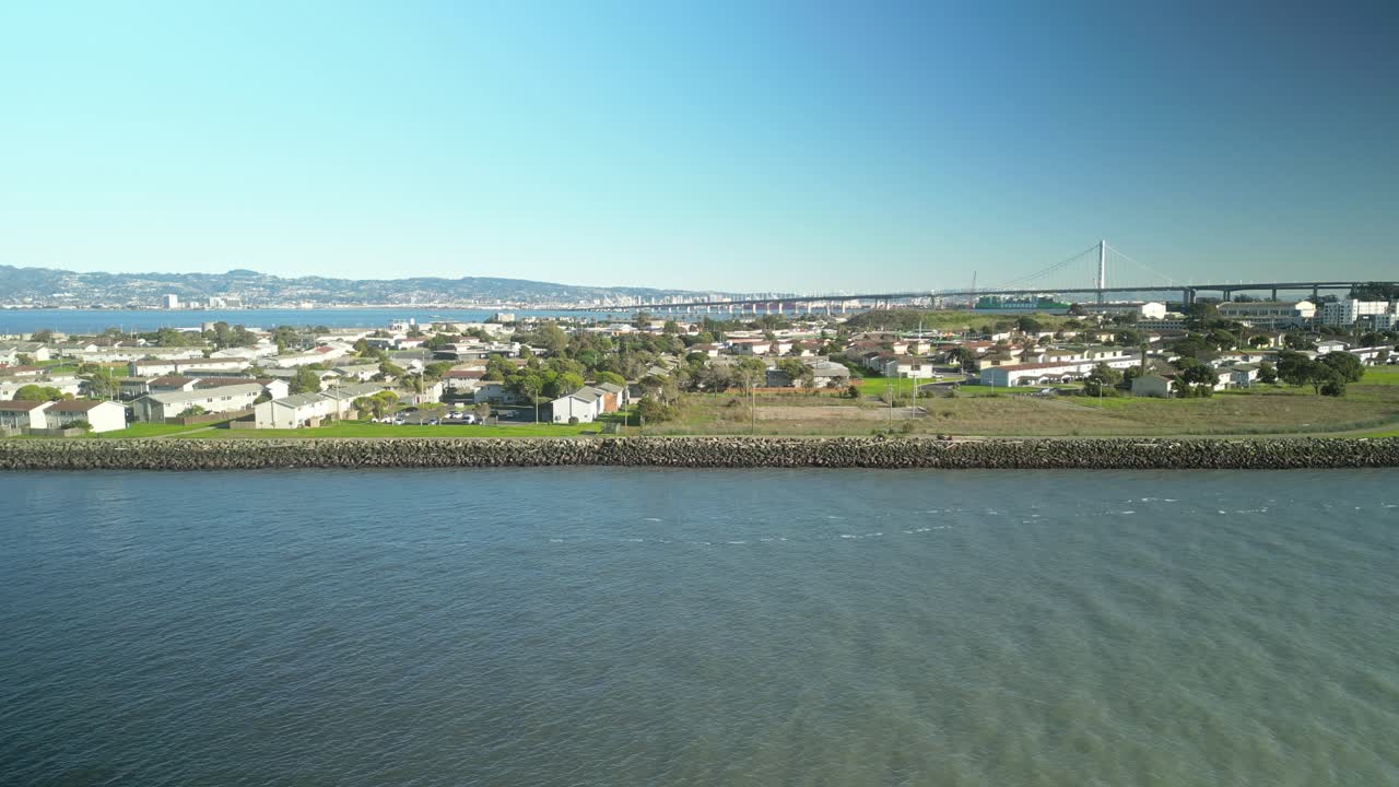 Establishing drone shot of Treasure Island and San Francisco-Oakland Bay Bridge in California, USA