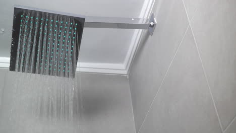 hot water flowing from square shower head