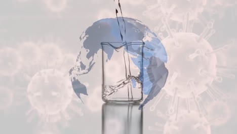 Globe-spinning-with-liquid-flowing-into-a-beaker-with-Covid-19-spreading-in-the-background