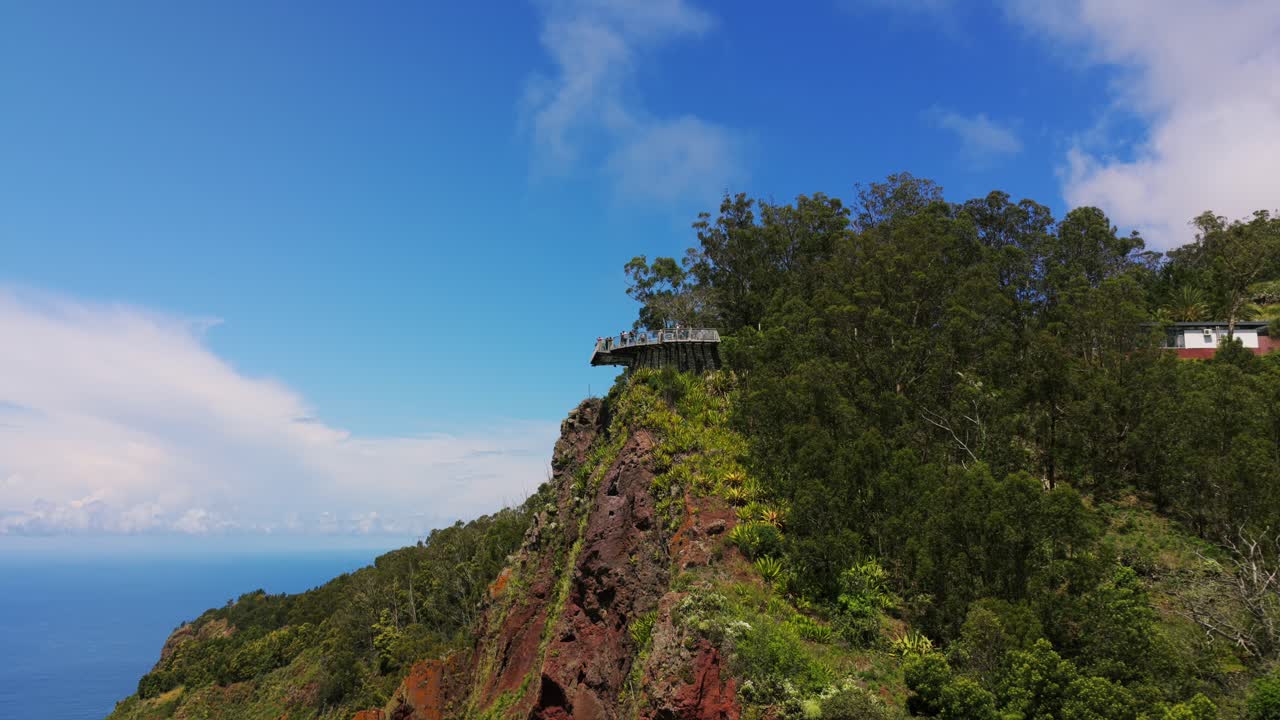 Aerial view of Cabo Girao Skywalk, a glass platform suspended over a dramatic cliff offering stunning views of the Atlantic Ocean and Madeira's coastline. Pedestal Down