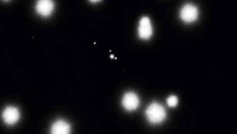 animación de puntos de luz brillantes sobre un fondo negro