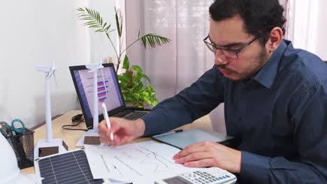 engineer brainstorming solutions for a sustainable energy project