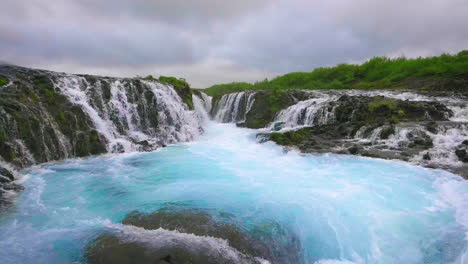 Drone-aerial-view-of-Bruarfoss-waterfall-in-Brekkuskogur,-Iceland.