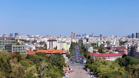 aerial view of tineretului park entrance with bucharest's traffic and cityscape in the background, romania
