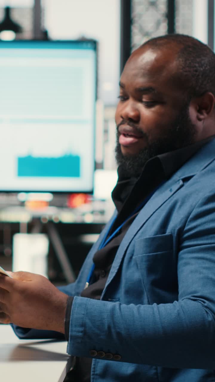 Vertical Video Professional archivist uses rolling trolley to transport documents