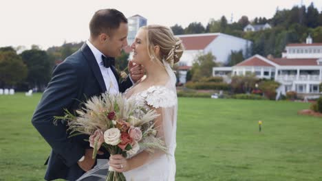bride and groom kiss romantically