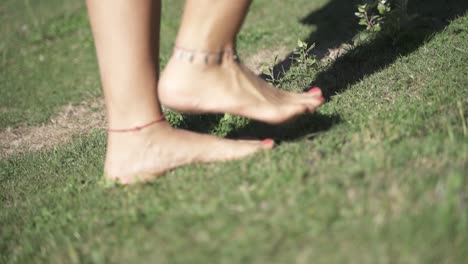 young female walking on the grass close up steps outdoors2 slow motion and 60fps