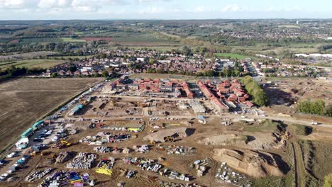 campos sajones canterbury construcción cimientos 4k drone aéreo alto y ancho dolly hacia atrás sitio de construcción completo