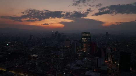 illuminated building lights of downtown mexico city at night, aerial