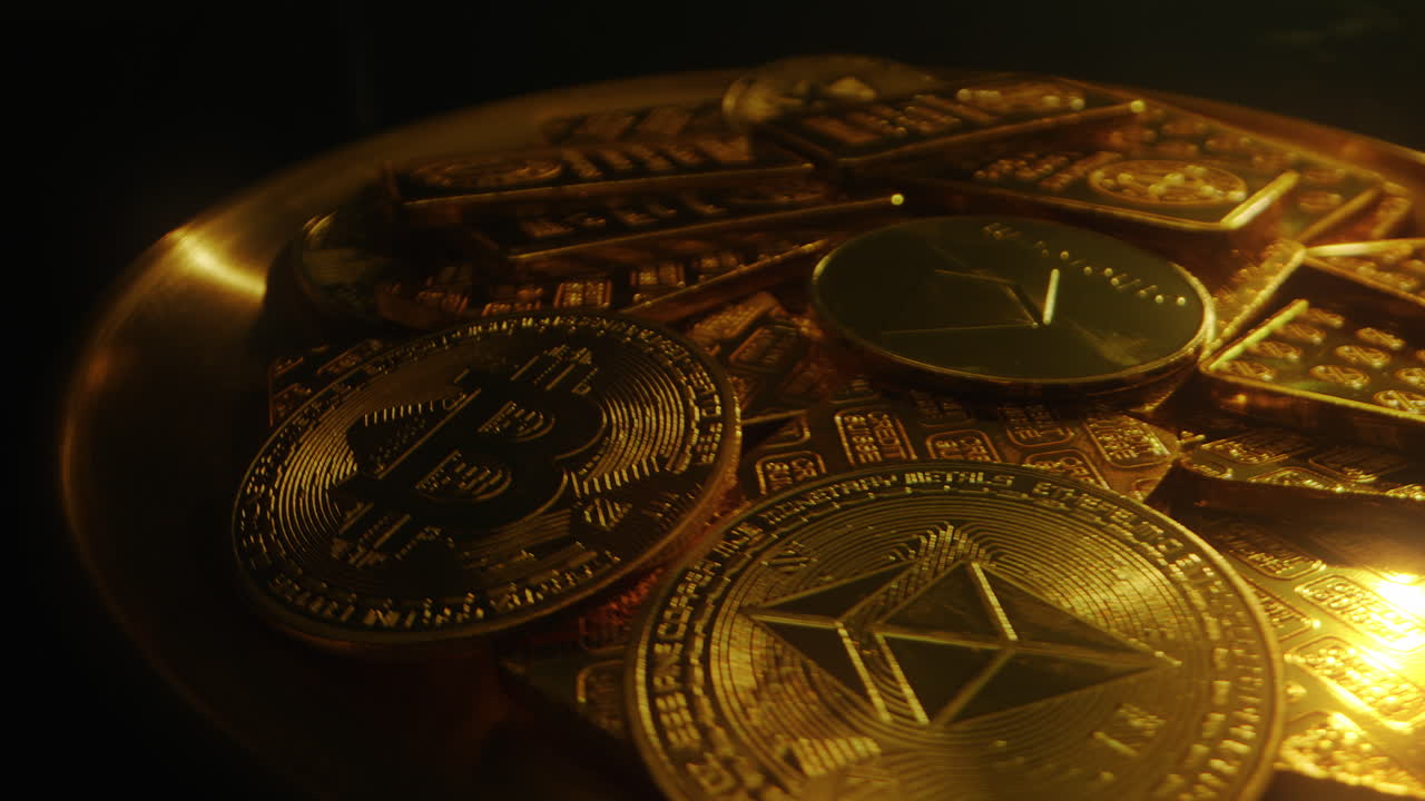 Heap Of Gold Bitcoin And Ethereum Coins With Swiss Fine Gold Bars In Rotating Tray. closeup shot