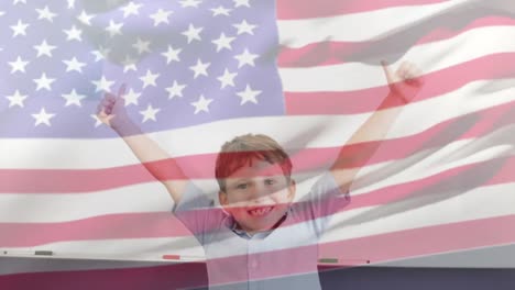 animation of flag over american blowing over smiling caucasian schoolboy with thumbs up in class