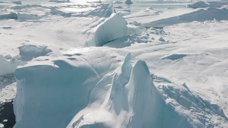 drone over sea and ice of ilulissat icefjord