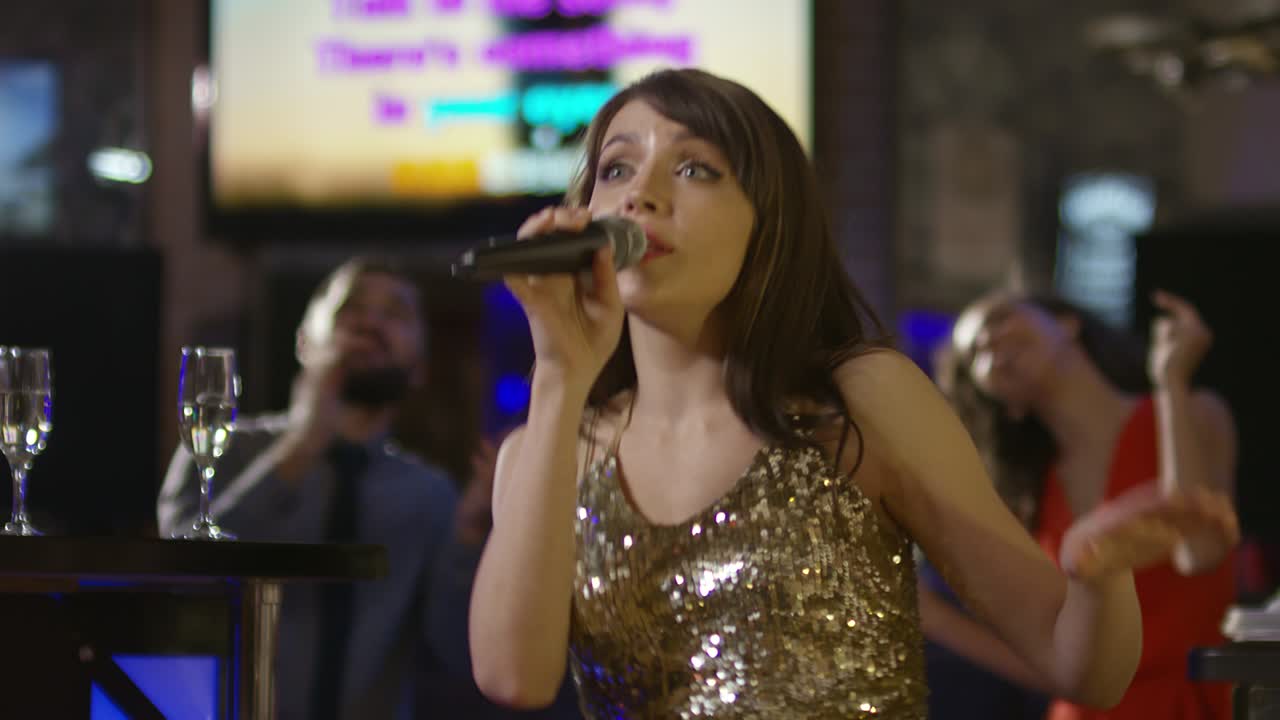 Attractive Woman Singing in Karaoke Bar