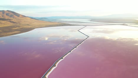 pink and purple pond waters, solar salt evaporation in utah by great salt lake