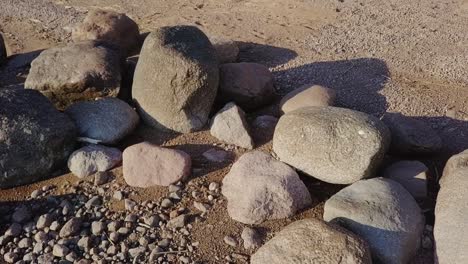 Rocky-beach-shore-with-many-boulders-and-blue-sea-nordic-nature