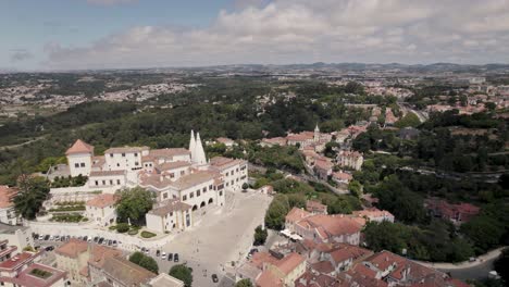 set of buildings of sintra national palace with two conical chimneys standing out