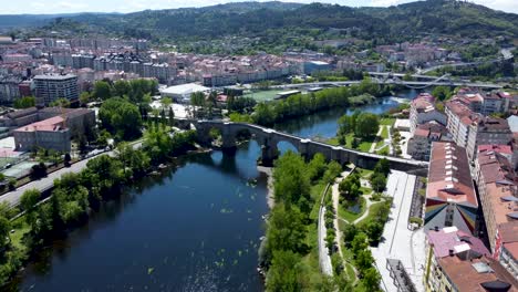 miño river as it passes through ancient bridge in the city of ourense