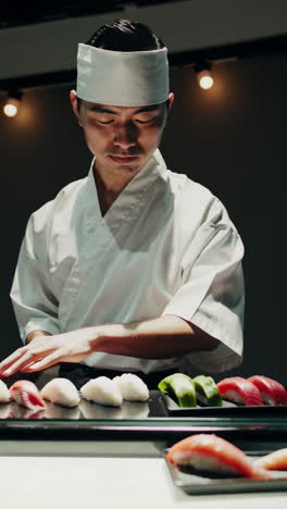 sushi chef preparing fresh sushi