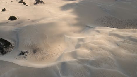 aerial flyover australian sandy desert during sunny day and cloudy day