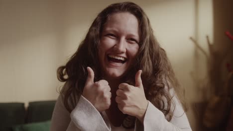 happy woman giving thumbs up and laughing