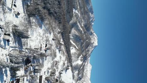 Aerial-view-orbiting-Mount-Myoko,-portrait-video