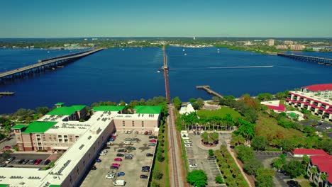 aerial view of bradenton, florida with bridge over blue river, green parks, and city