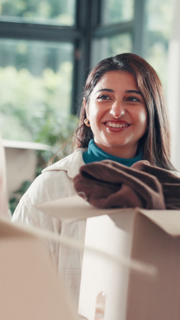Happy Young Woman Laughing While Packing Cardboard Boxes