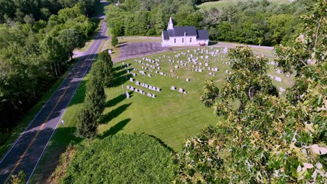 quaint chuch chapel through the treetops push in aerial near fries virginia