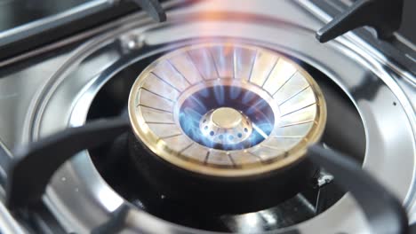 close-up of a portable gas stove burner with flame