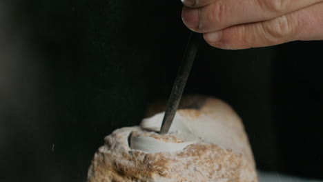 close-up of stone carving process