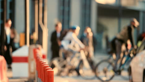 people cycling through the city in the morning