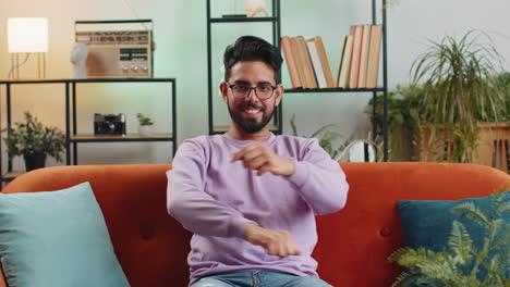 excited happy indian man surprised shocked by sudden victory good win news celebrating wow reaction
