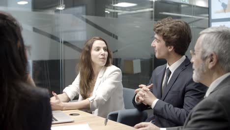 Focused-business-team-communicating-in-conference-room