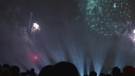 group watching a bright and sparkling fireworks show