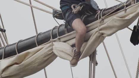 ferdinand magellan nao victoria carrack boat replica mast with worker fixing ropes in slow motion 60fps