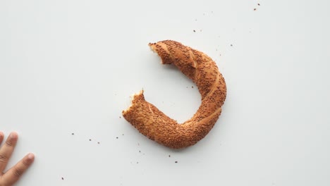 child eating a simit