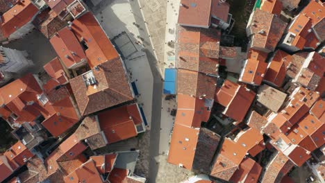 top down view of croatian roof tiles in the town of cres, croatia - aerial shot